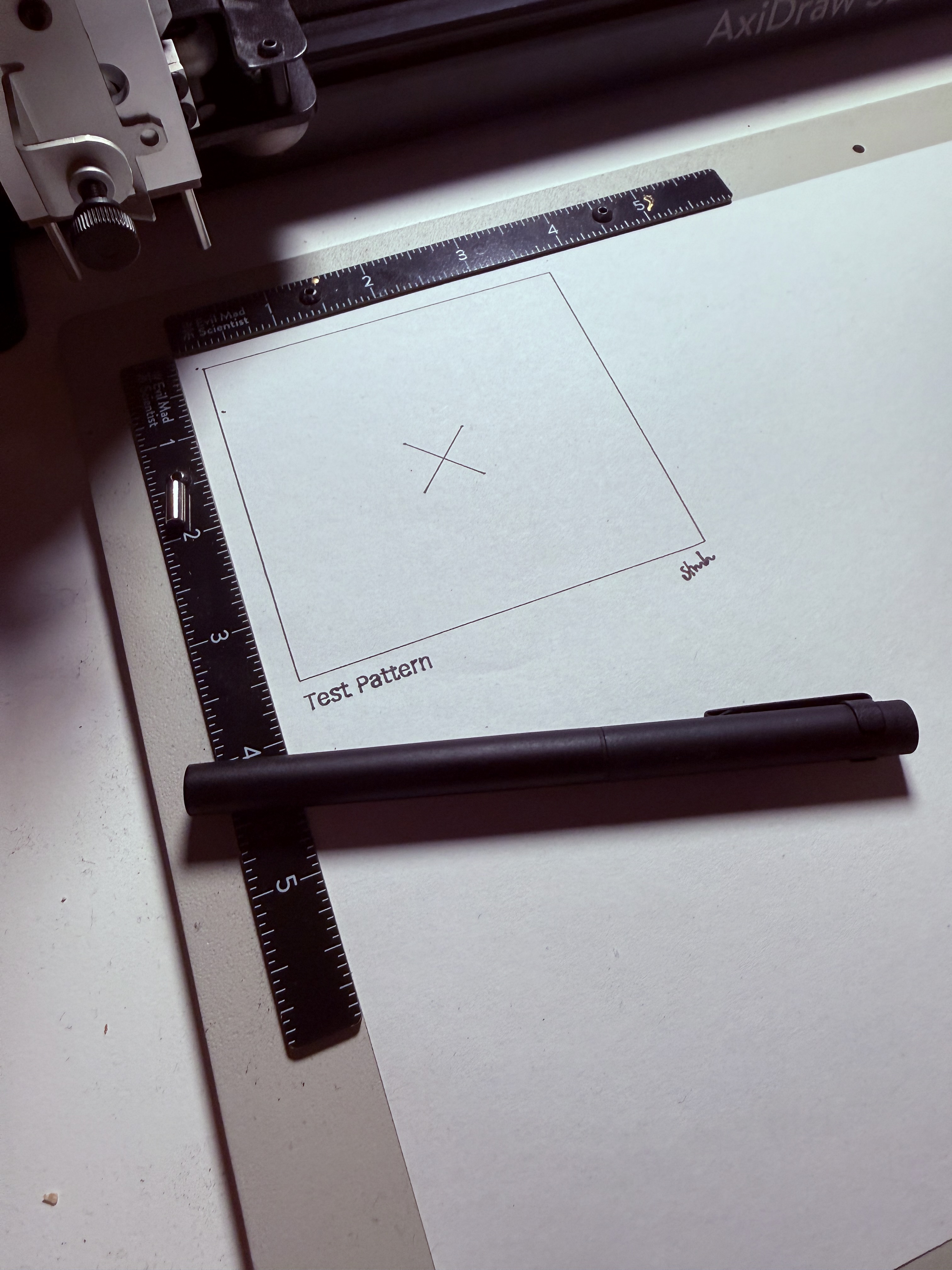 First successful plot: a simple rectangle with an X mark and signature, labeled Test Pattern